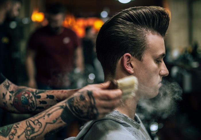 barber finishing a style
